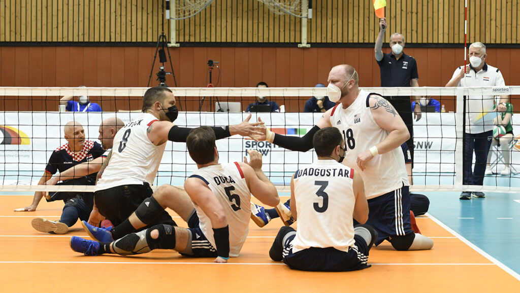 men's sitting team celebrates a point